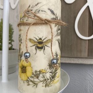 Decorative Cream Candle with Yellow Floral Design